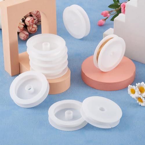 Craftdady 50Pcs Empty Plastic Wire Spools 2.64" in Diameter Thread Bobbins for Beading Wire Thread String - color: White, Plastic Wire Spools